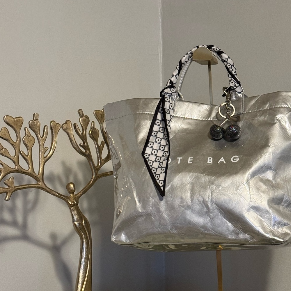 Metallic Silver Tote Bag with Reflective Finish and Studded Detail